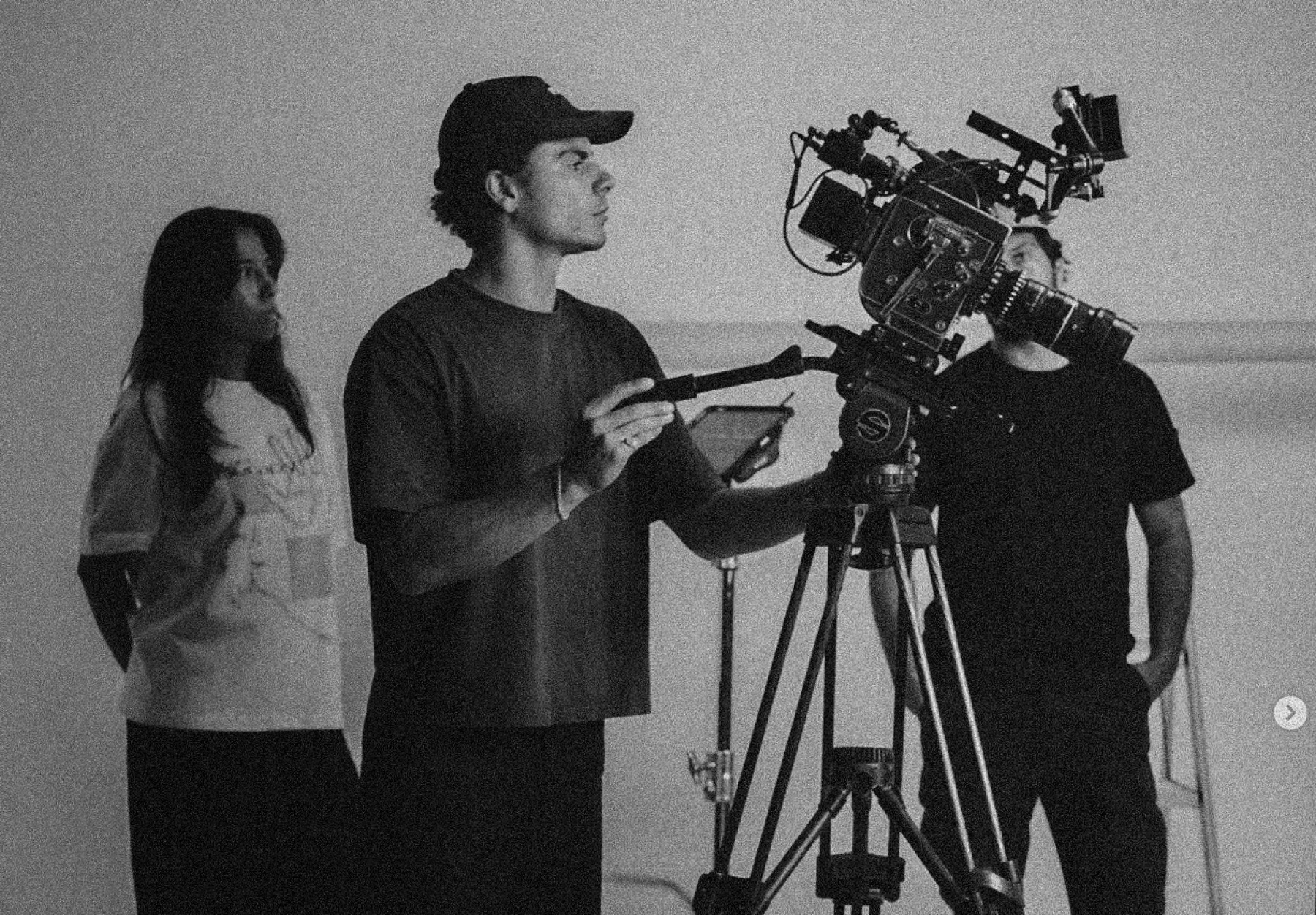 Rhys Warren on set behind a cinema camera